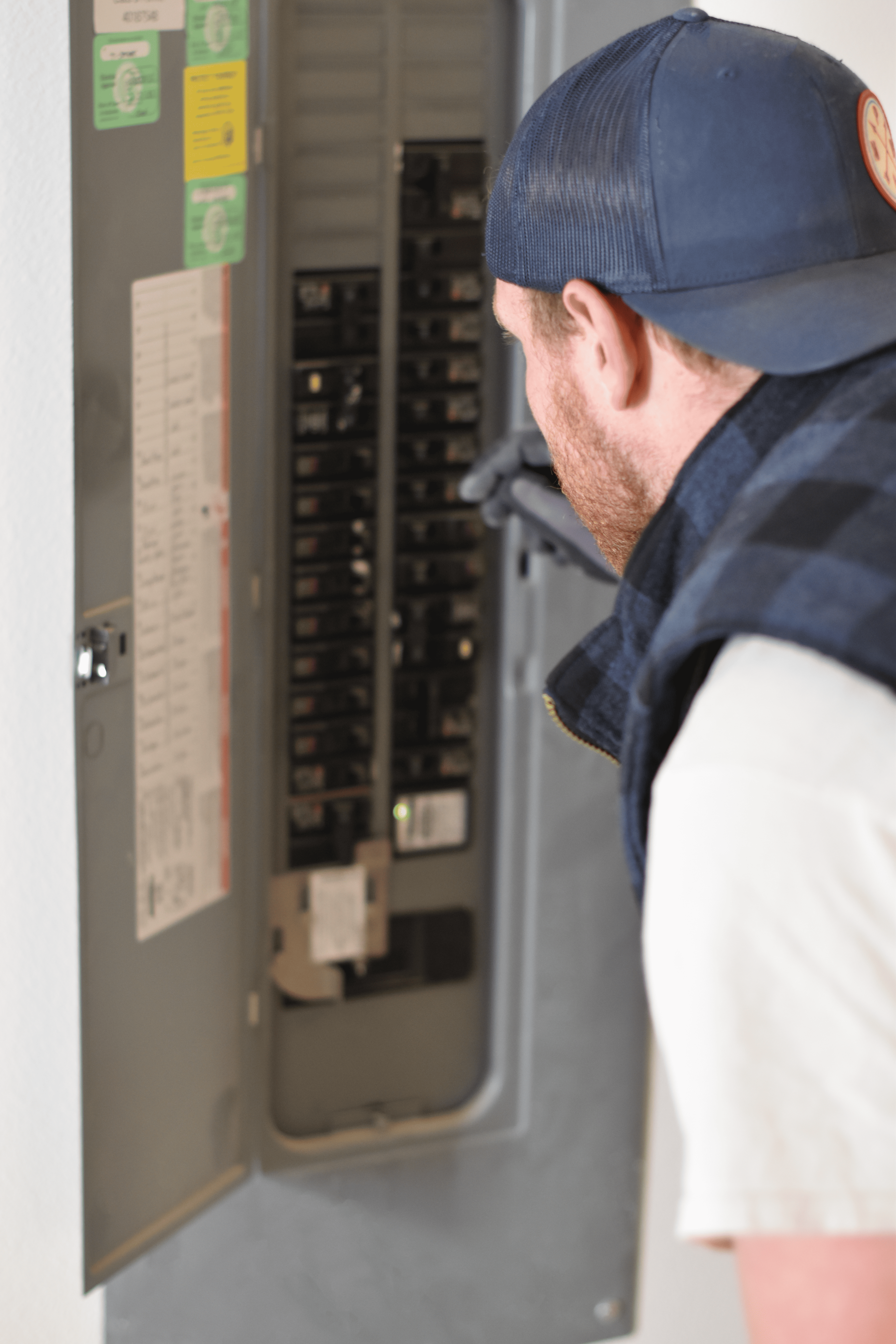 Electrician in electrical panel for panel upgrade