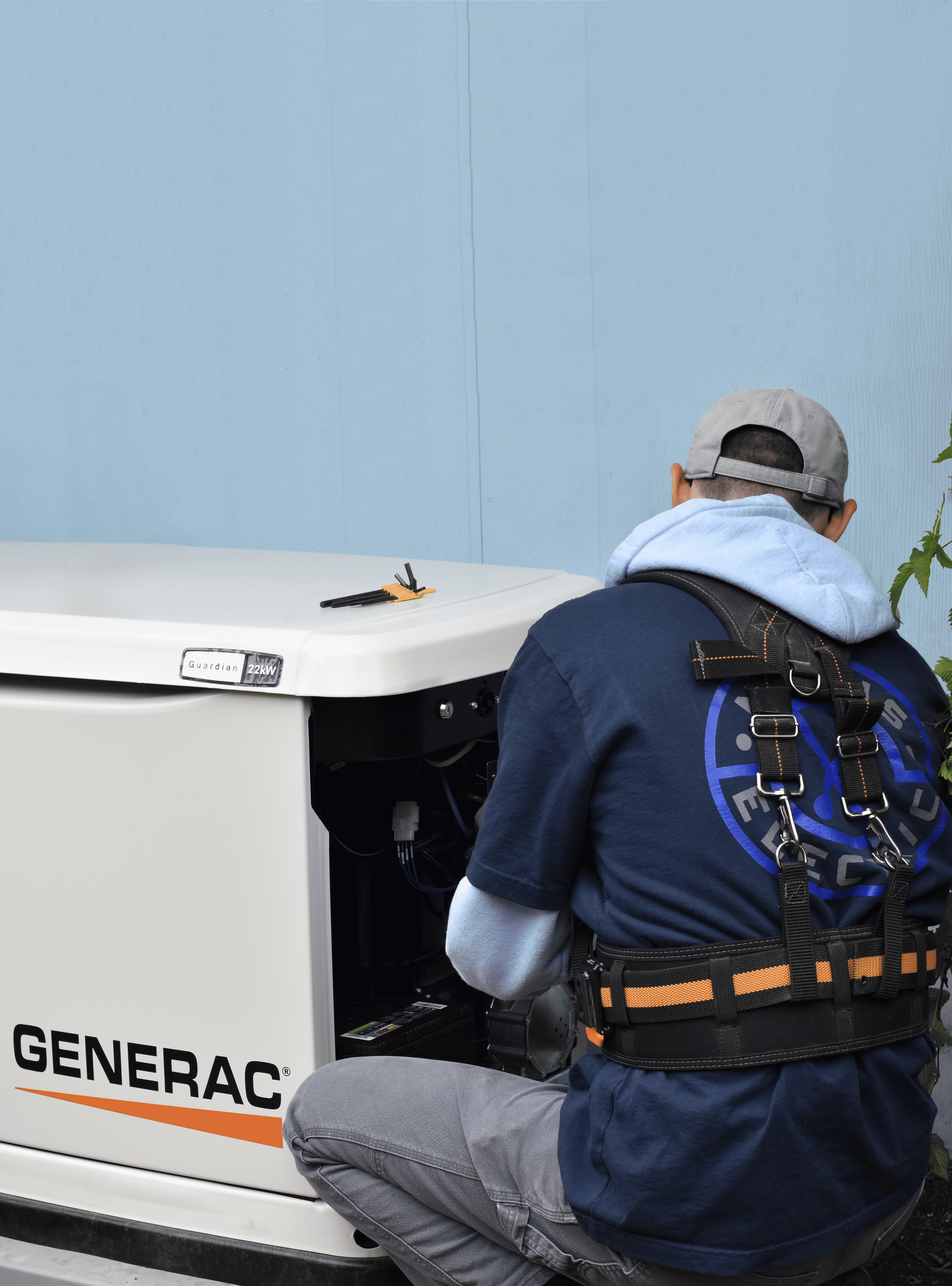 Electrician installing a generac generator